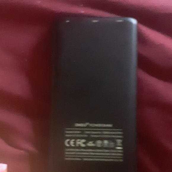 A blue light up paw charging bank with charger - Picture 4 of 5